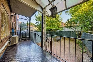 Rare opportunity to own a legal two-family brick home in the - photo 3