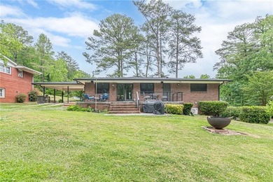 A classic brick ranch, reimagined with intention and scale, set - photo 11