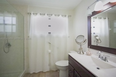 This charming 1988-built residence offers three bedrooms and two - photo 11