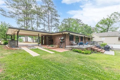 A classic brick ranch, reimagined with intention and scale, set - photo 12