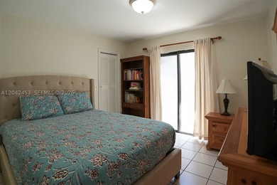 This charming 1988-built residence offers three bedrooms and two - photo 13