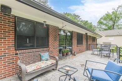 A classic brick ranch, reimagined with intention and scale, set - photo 14