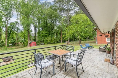 A classic brick ranch, reimagined with intention and scale, set - photo 15