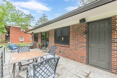 A classic brick ranch, reimagined with intention and scale, set - photo 16