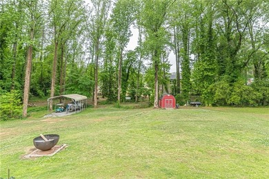 A classic brick ranch, reimagined with intention and scale, set - photo 17