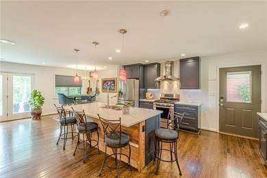A classic brick ranch, reimagined with intention and scale, set - photo 19