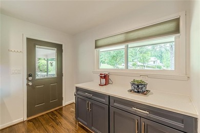 A classic brick ranch, reimagined with intention and scale, set - photo 20