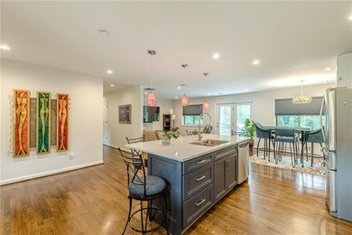 A classic brick ranch, reimagined with intention and scale, set - photo 22
