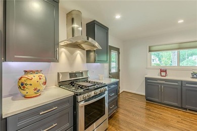 A classic brick ranch, reimagined with intention and scale, set - photo 24