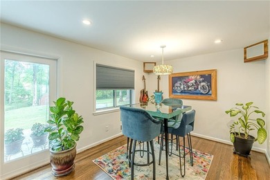 A classic brick ranch, reimagined with intention and scale, set - photo 26