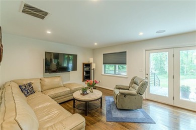 A classic brick ranch, reimagined with intention and scale, set - photo 29