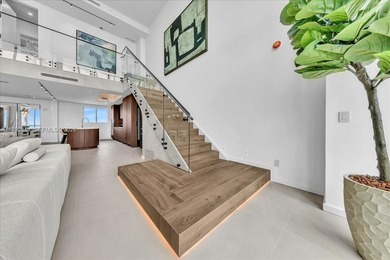 A TRUE MASTERPIECE! Fully Renovated 2 Story Penthouse with over