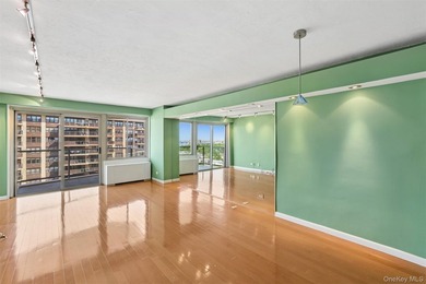 Welcome to Residence 15L at Towers at Water's Edge, a bright - photo 2