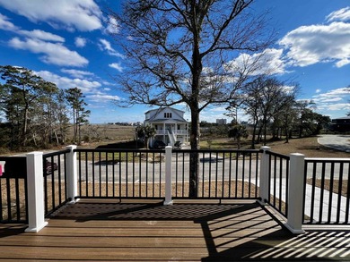 Welcome to 903 Inlet View Drive in the coveted gated community - photo 3