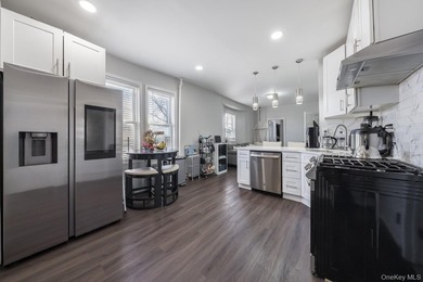 Welcome to this unique three-family home, a strong income - photo 17