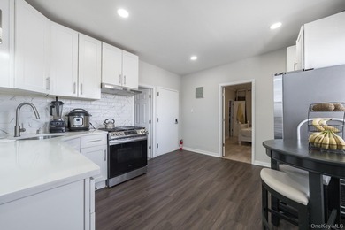 Welcome to this unique three-family home, a strong income - photo 18