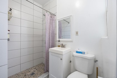 Welcome to this unique three-family home, a strong income - photo 26