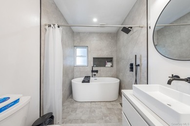 Welcome to this unique three-family home, a strong income - photo 33