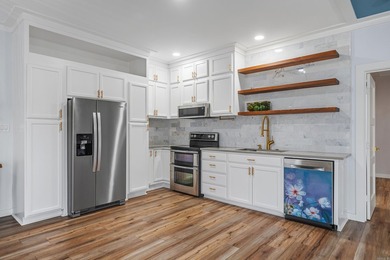 Wake up to the water every single day. This completely remodeled - photo 10