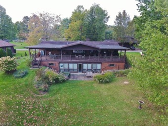 Endless options with 4 bedroom, 2 bath lake front  brick ranch - Lake Home For Sale in Dellroy, Ohio