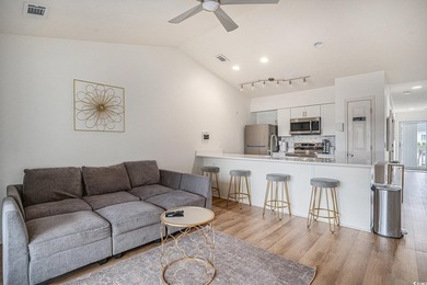This top-floor remodeled, 1-bedroom, 1-bath condo offers a - photo 2