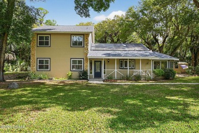 Nestled on 2.38 peaceful acres in beautiful Ormond Beach, this - photo 2