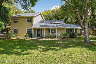 Nestled on 2.38 peaceful acres in beautiful Ormond Beach, this - photo 3