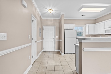 Welcome to this charming 2-bedroom, 2-bathroom first-floor condo