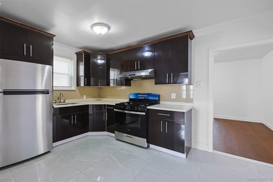 Welcome to this beautifully renovated detached 2-family home in - photo 3
