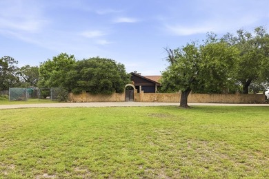 This Mediterranean-style Hill Country residence sits on more - photo 8