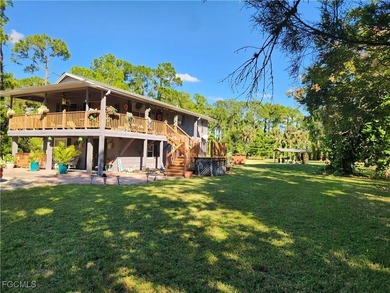 Tucked away in the heart of Golden Gate Estates, this warm and - photo 1