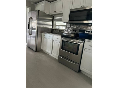 Renovated Waterfront 1334 sq ft manufactured home in 55 + resort - photo 3