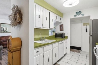 Welcome to this beautifully maintained second-floor condominium - photo 10