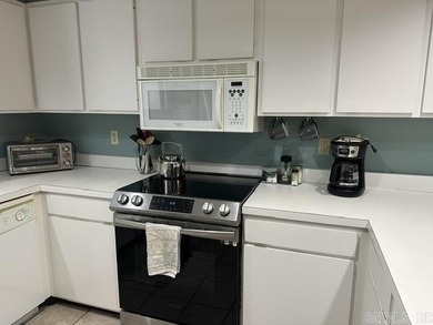 Enjoy this partially furnished condo tucked among the trees - photo 4