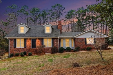 Welcome to this spacious 4-sided brick home with painted cedar