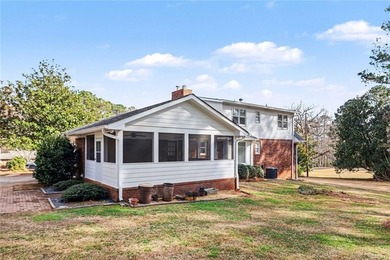 Welcome to this spacious 4-sided brick home with painted cedar