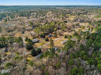 Welcome to this spacious 4-sided brick home with painted cedar