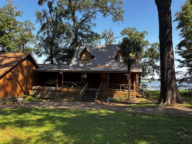 Rustic Lakefront Log Home with Stunning Sunsets No HOA - photo 3