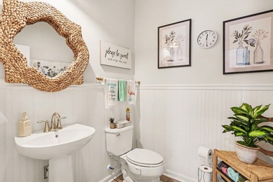 Southern charm meets peaceful waterfront living in this