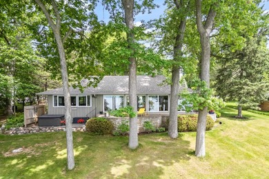 This 4-bedroom, 3-bath midcentury lake home offers 100 feet of - photo 3