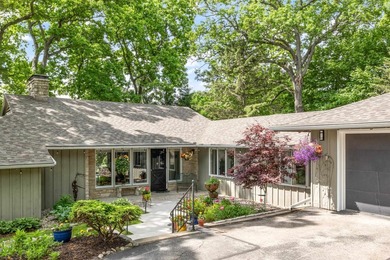 This 4-bedroom, 3-bath midcentury lake home offers 100 feet of - photo 4