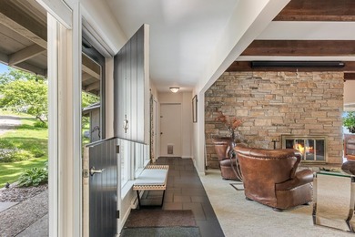 This 4-bedroom, 3-bath midcentury lake home offers 100 feet of - photo 7