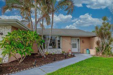 Welcome to this charming 2-bedroom, 2-bath pool home in the - photo 2