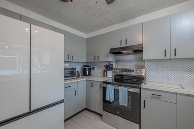 Welcome to this charming 2-bedroom, 2-bath pool home in the - photo 8