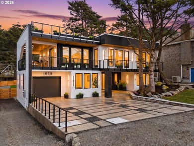 Discover a unique, custom-built home on the beachside, offering - photo 1