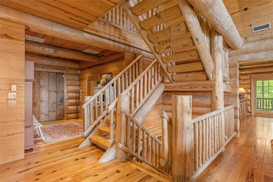 Perched atop over 12 secluded acres, this majestic log cabin - photo 15