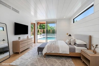 Just moments from the beach, this architecturally striking East - photo 16