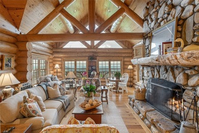 Perched atop over 12 secluded acres, this majestic log cabin - photo 17