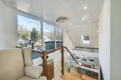 Just moments from the beach, this architecturally striking East - photo 18