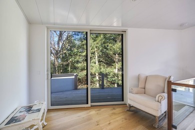 Just moments from the beach, this architecturally striking East - photo 19